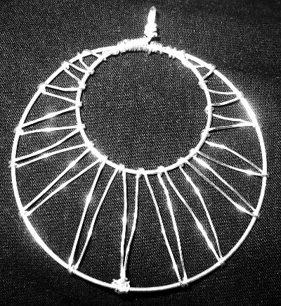 black sparkling wire sun pendant